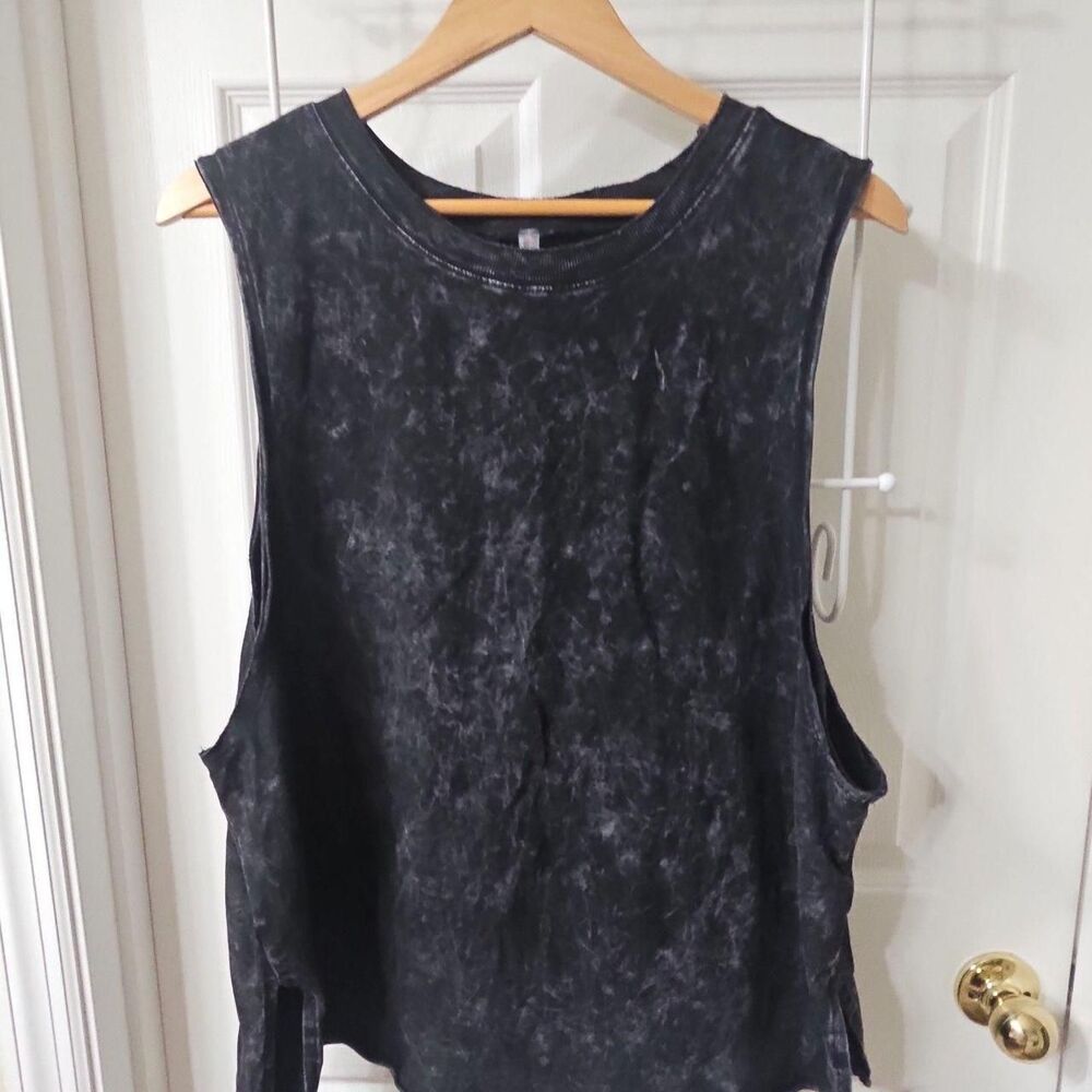 Free People Movement sleeveless muscle tank in black acid wash.